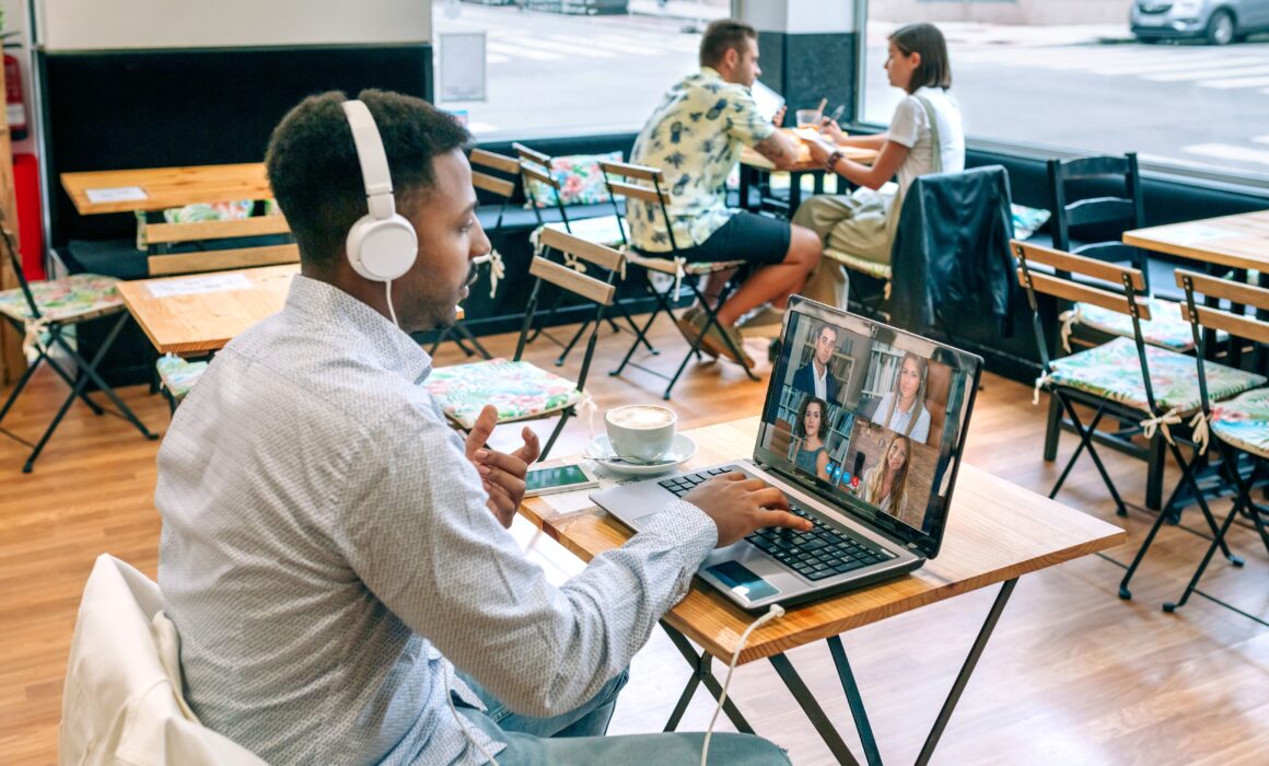 man using a video collaboration tool for a remote team work meeting