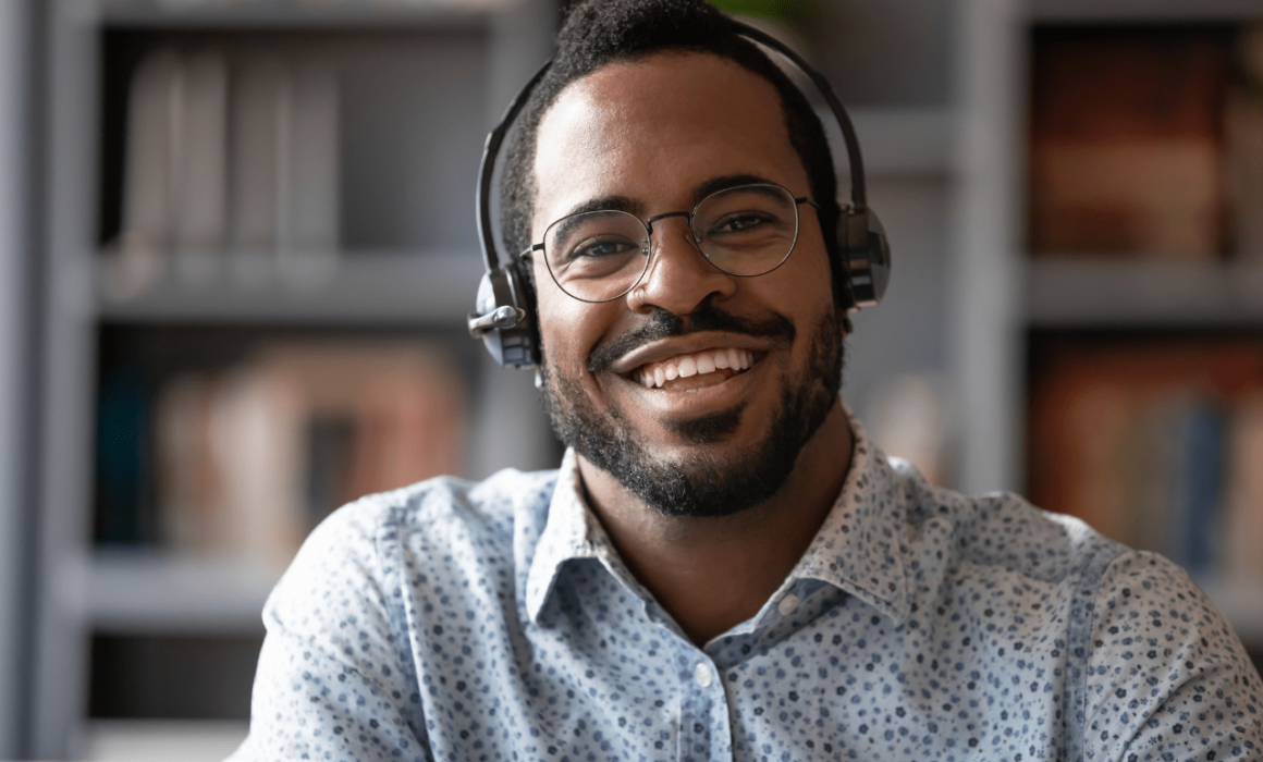 Happy Customer Support Specialist Helping a Tech Startup Succeed