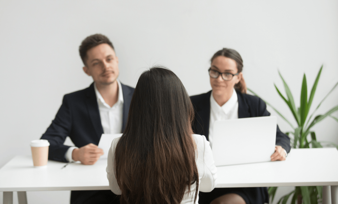Business manager reviewing hiring options with part-time and full-time offshore staff in mind.