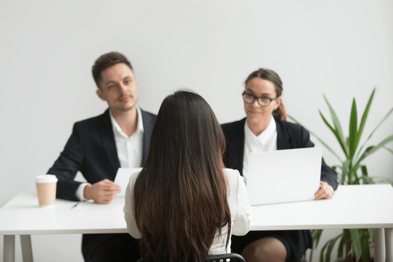 Business manager reviewing hiring options with part-time and full-time offshore staff in mind.
