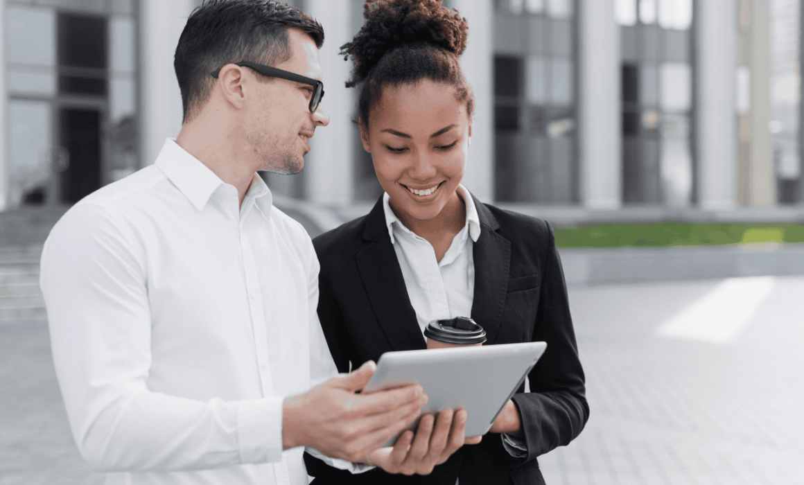 A manager speaking with a marketing assistant