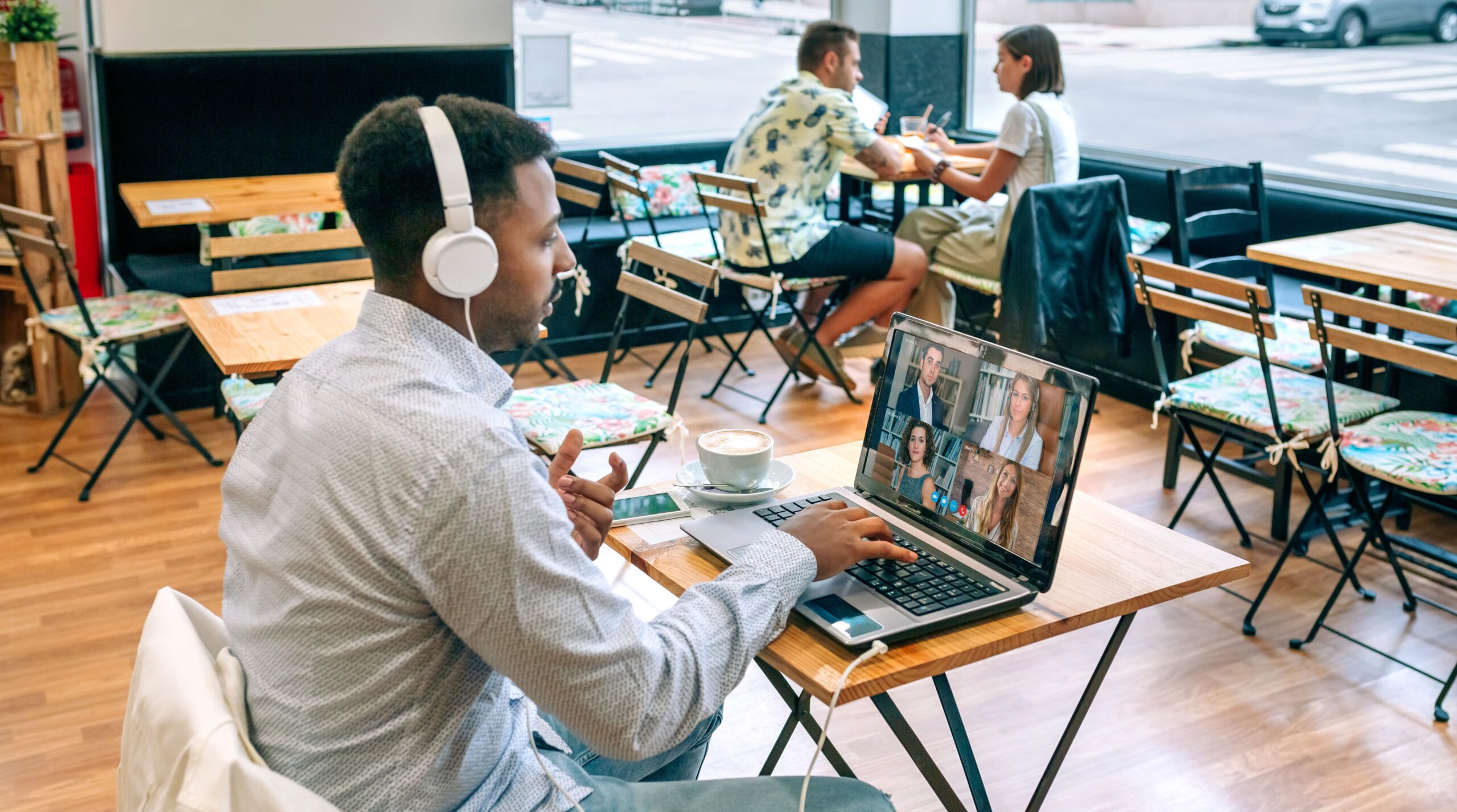 man using a video collaboration tool for a remote team work meeting